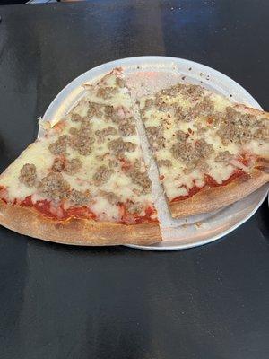 Two slices of Lunch 2 Slice Pizza Special. Sausage was an extra 60 cents. One slice would have been enough for lunch.