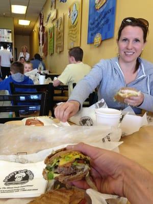 Lisa, former loyal Port of Subs employee at sister location in Gardnerville, NV, models in front of a juicy Philly cheese steak.