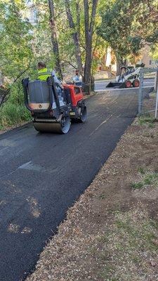 Steamroller over new asphalt