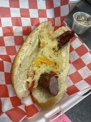 Smoked Kielbasa sandwich with kraut, peppers and onions