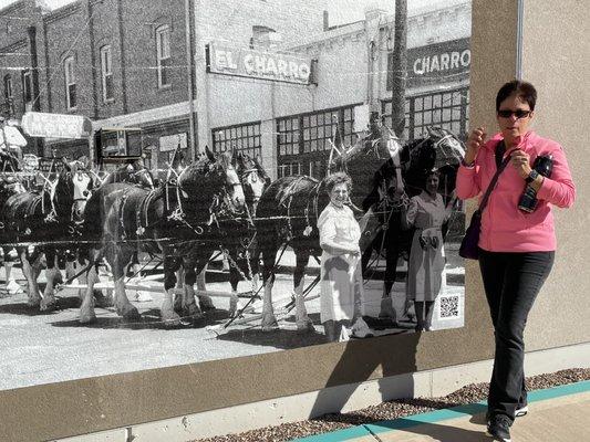 Me in front of an original photo of the first Hispanic Mexican restaurant in town El Charro