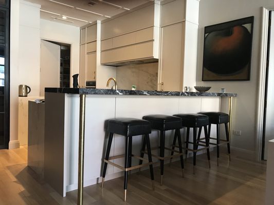 Waterfall counter with brass legs.