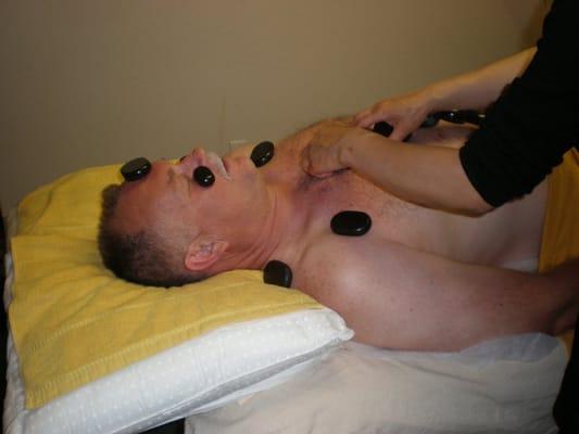 Hot stone massage for penetrating heat and deep tissue therapy.