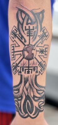 Bottom portion of Yggdrasil (Norse world tree) with the earth in the trunk surrounded by Vegvisir.