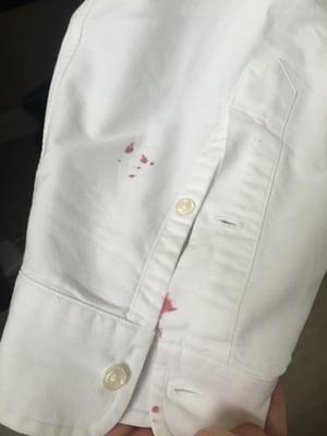 Pink ink on sleeve that was not there when dropping the shirt off