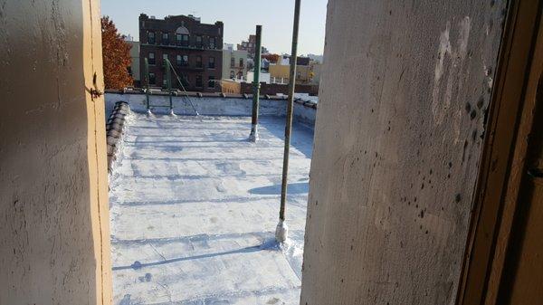 Fresh layer of Aluminum Paint on a brand new roof in Astoria.