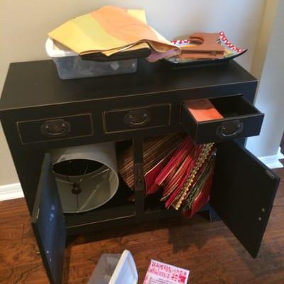 Lampshade shoved into cabinet that had not been emptied.  Several shades were damaged due to similar packing.