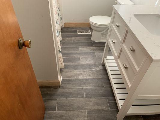 Bathroom remodeling. Replaced sub flooring, new tiles, new trim and vanities.