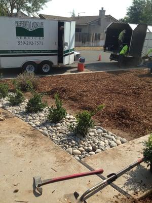 Preferred Landscape crew putting in the river rock