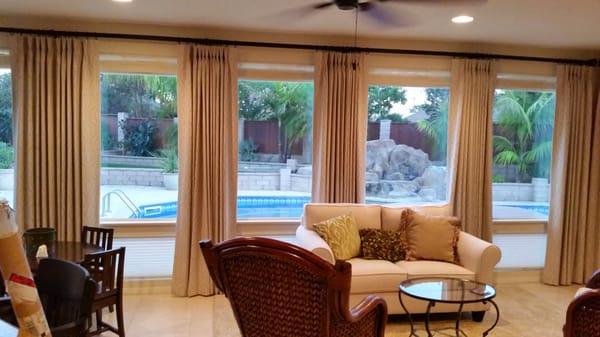 Custom Drapery over Solar Roman Shades and Cellular shades in Santa Maria by Rendezvous shutters shades drapery