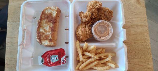 Three piece chicken tenders with fries toast cane sauce and ketchup