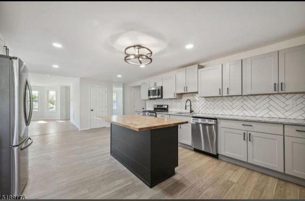 Newly finished kitchen with a new island and counter top that we provided