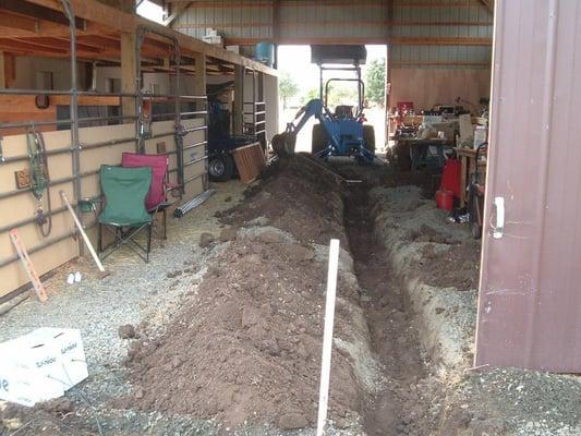 Ditch for a water line in a barn