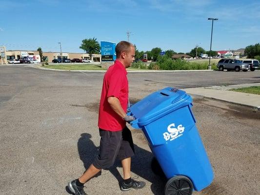 Chuck, one of our awesome drivers, is exchanging an empty bin for the locked full bin.