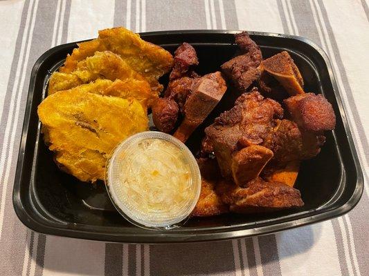 Griot (fried pork), fried plantains and their version of coleslaw