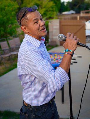 A man enjoying an entertaining evening of karaoke.