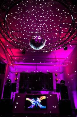 Only purple uplighting and a disco ball transform this room for night of fun. Let's party!