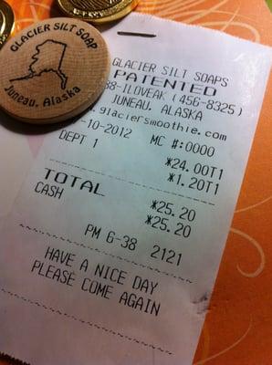 Receipt for three soaps, plus a wooden nickel with a discount code for ordering online.