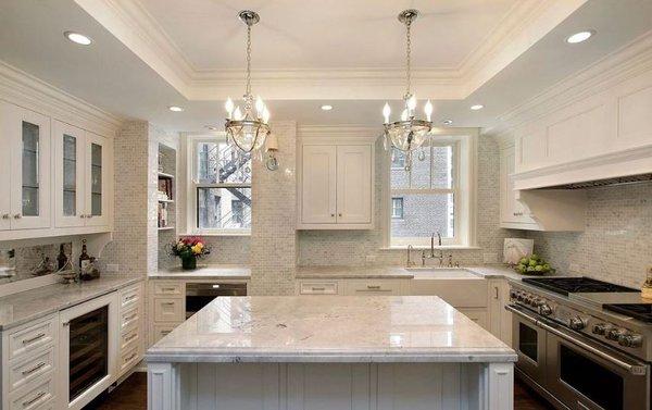 This beautiful kitchen with Marble Mosaics was designed by Luxe Nest Interiors