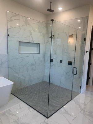 Frameless shower glass enclosure