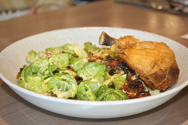 The Salad of Brussels Sprouts with Chicken was made with fresh and crispy brussels sprouts leaves, dried plum, pickled daikon, sesame crisp.