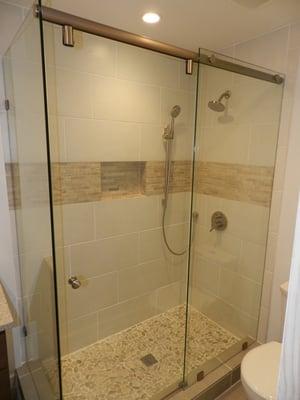 Tiled shower with framed in niche.