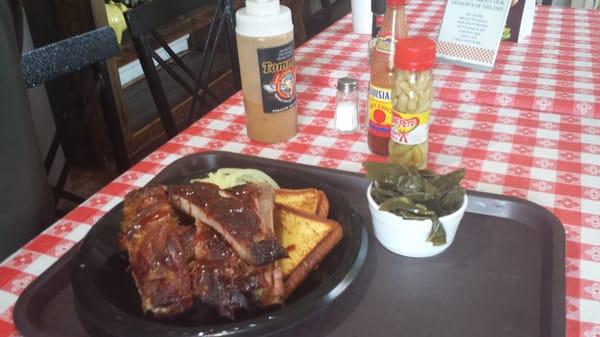 Rib's platter with onion, pickles, buttered toast and a side of collard greens