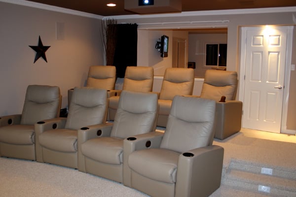 Wedge shaped theater seating; Floor framed to fit with lighted steps; Automated curtain shuts in front of bar seating during daylight hours.