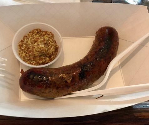 Beef bratwurst and the beat mustard around.