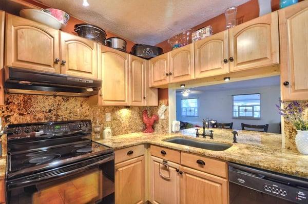 Full granite back splash with matching granite countertops