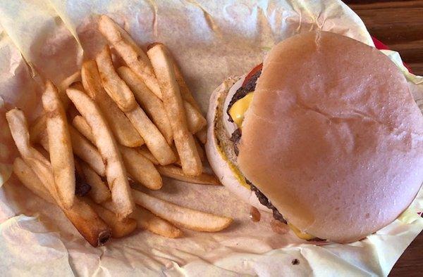 A fantastic cheese burger and 1/2 order of fries