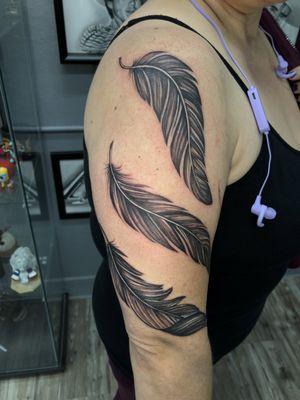 Three feathers along my right arm.