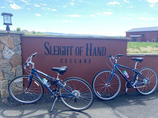 Hybrid bikes in front of a winery.