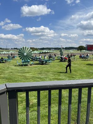 Alongside the grandstand. Perfect for watching the races in the shade.