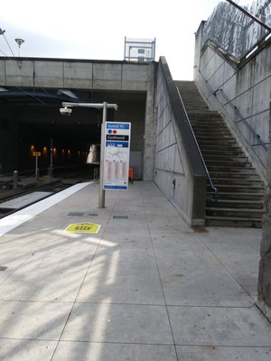 Stairs to upper level. Elevator in middle.