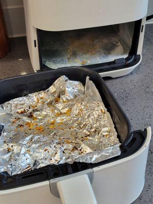 Cleaning crew didn't bother to clean out air fryer.