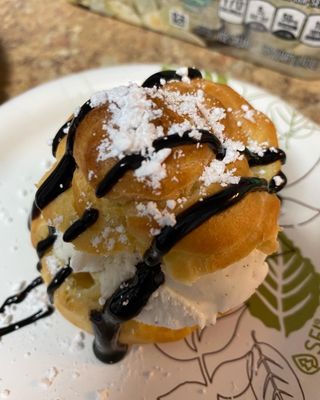 Cream Puffs with Vanilla ice cream, chocolate syrup and powdered sugar