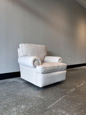 Oversized Club Chair with vintage round brass casters.