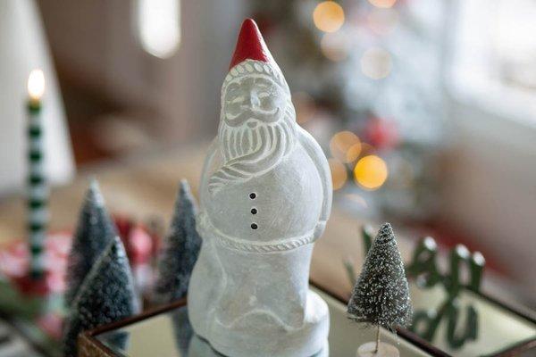 Roly Poly Santa, and cast in concrete and hand painted.