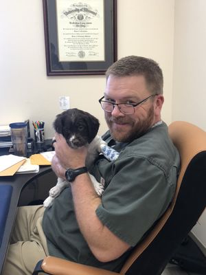 Dr. Shane Brookshire with one of our extra cute patients.