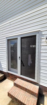 Door installation with custom swinging screens. Call us for your door and window needs.