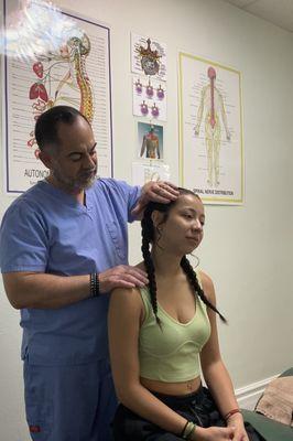 Patient receiving neck post isometric relaxation stretch