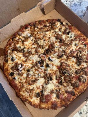 Custom 12" four topping pizza with mushrooms, olives, sausage, and pepperoni - delicious!