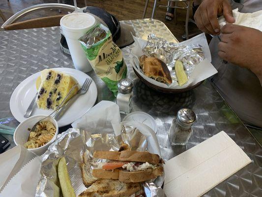 Chicken salad, cranberry walnut bread, lemon blueberry cake, and chicken poblano sandwich.