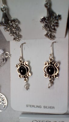 Handcrafted drop earrings of sterling silver,garnet , and cultured freshwater  pearls.