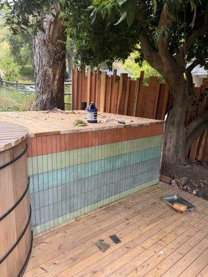 Jacuzzi deck with tile backsplash