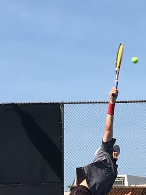 Reach and extend for a great serve!