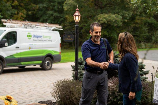 Shipley Energy HVAC Technician greets customer on a service call.