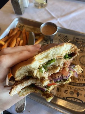 Chicken pesto sandwich with sweet potato fries.