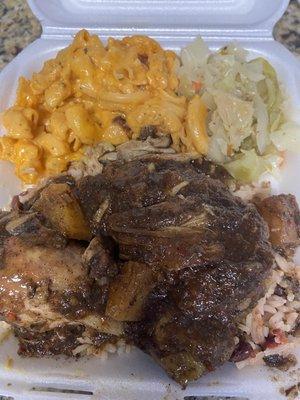 Pineapple Jerk Chicken with rice and beans, snack n cheese, and cabbage